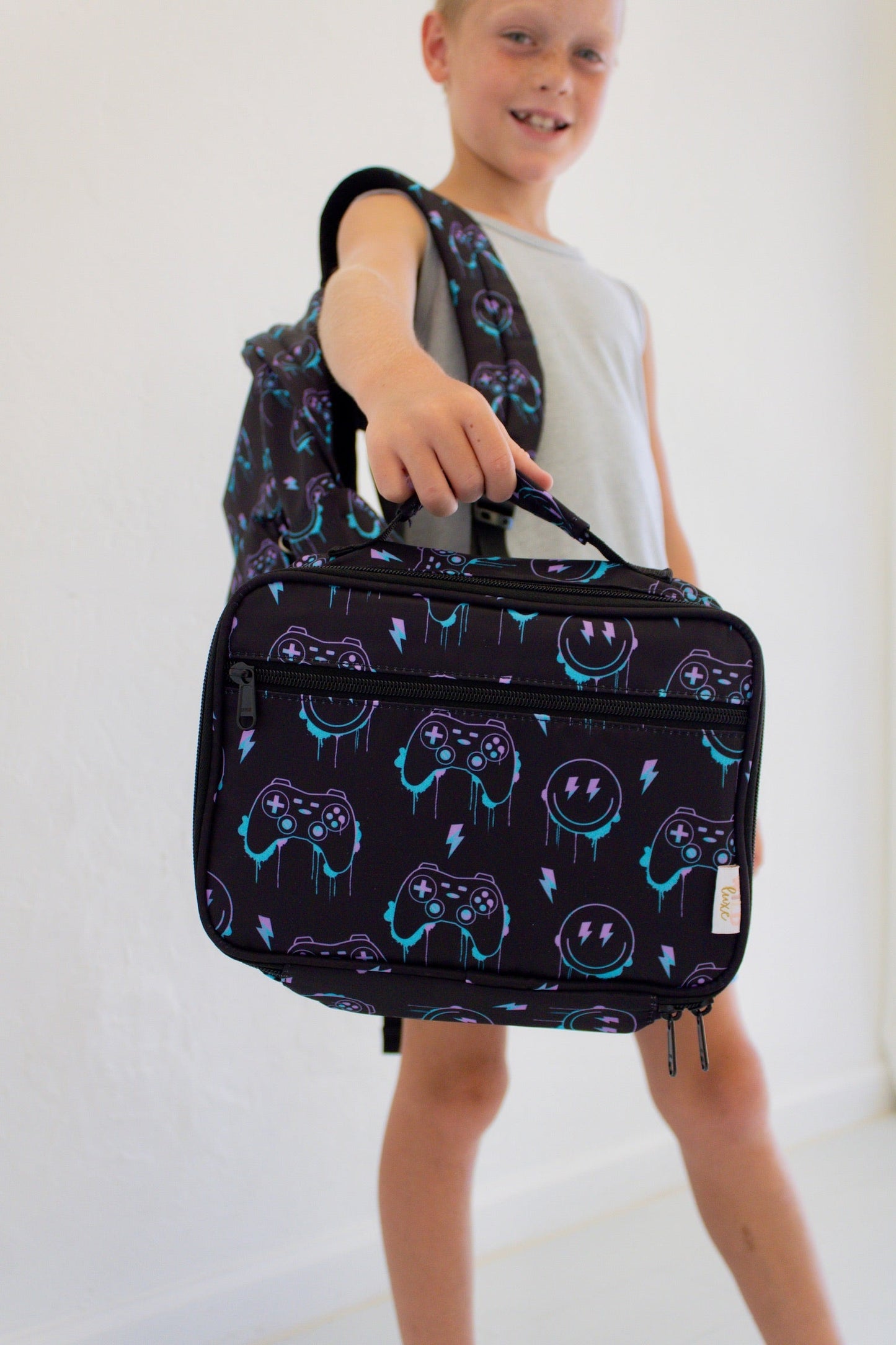 Niveau supérieur - Sac à dos et boîte à lunch