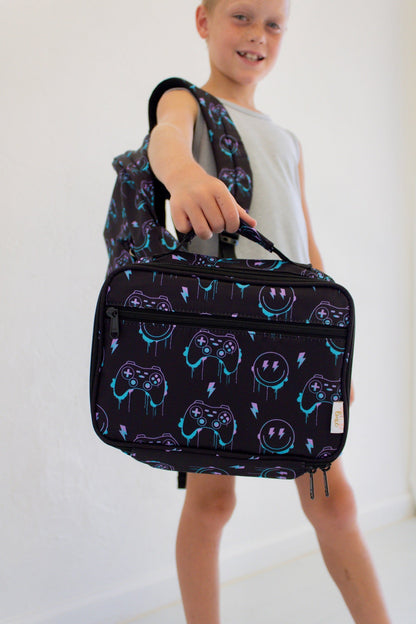 Niveau supérieur - Sac à dos et boîte à lunch