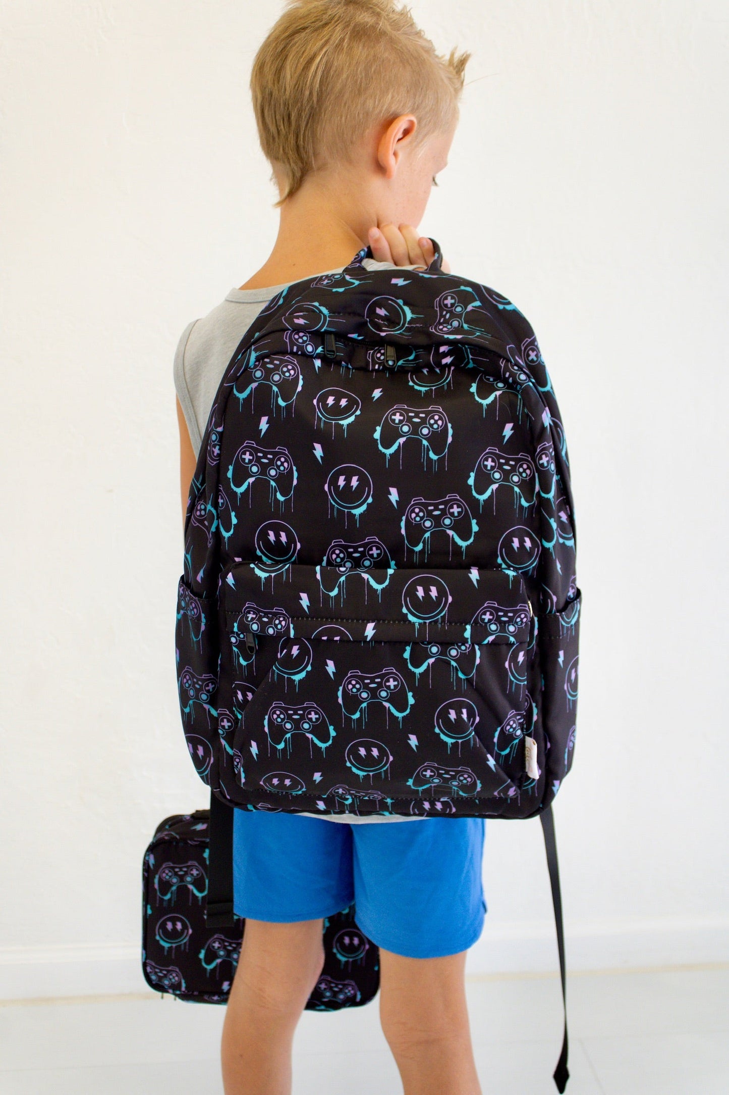 Niveau supérieur - Sac à dos et boîte à lunch