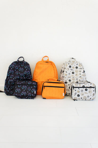 Niveau supérieur - Sac à dos et boîte à lunch